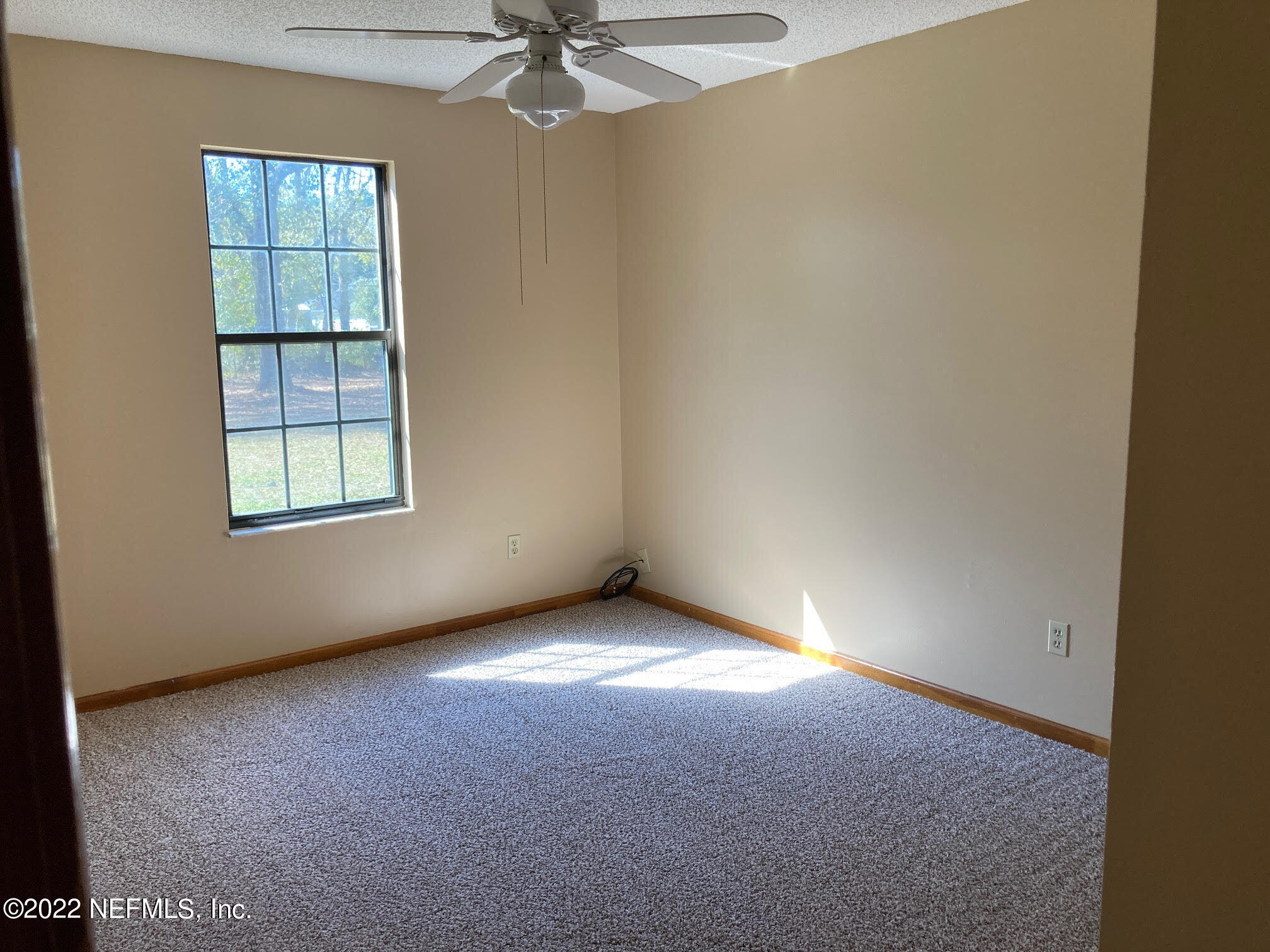 3970 Pinto Road Middleburg, FL 32068 - Photo 17 of 53 an empty room with a window
