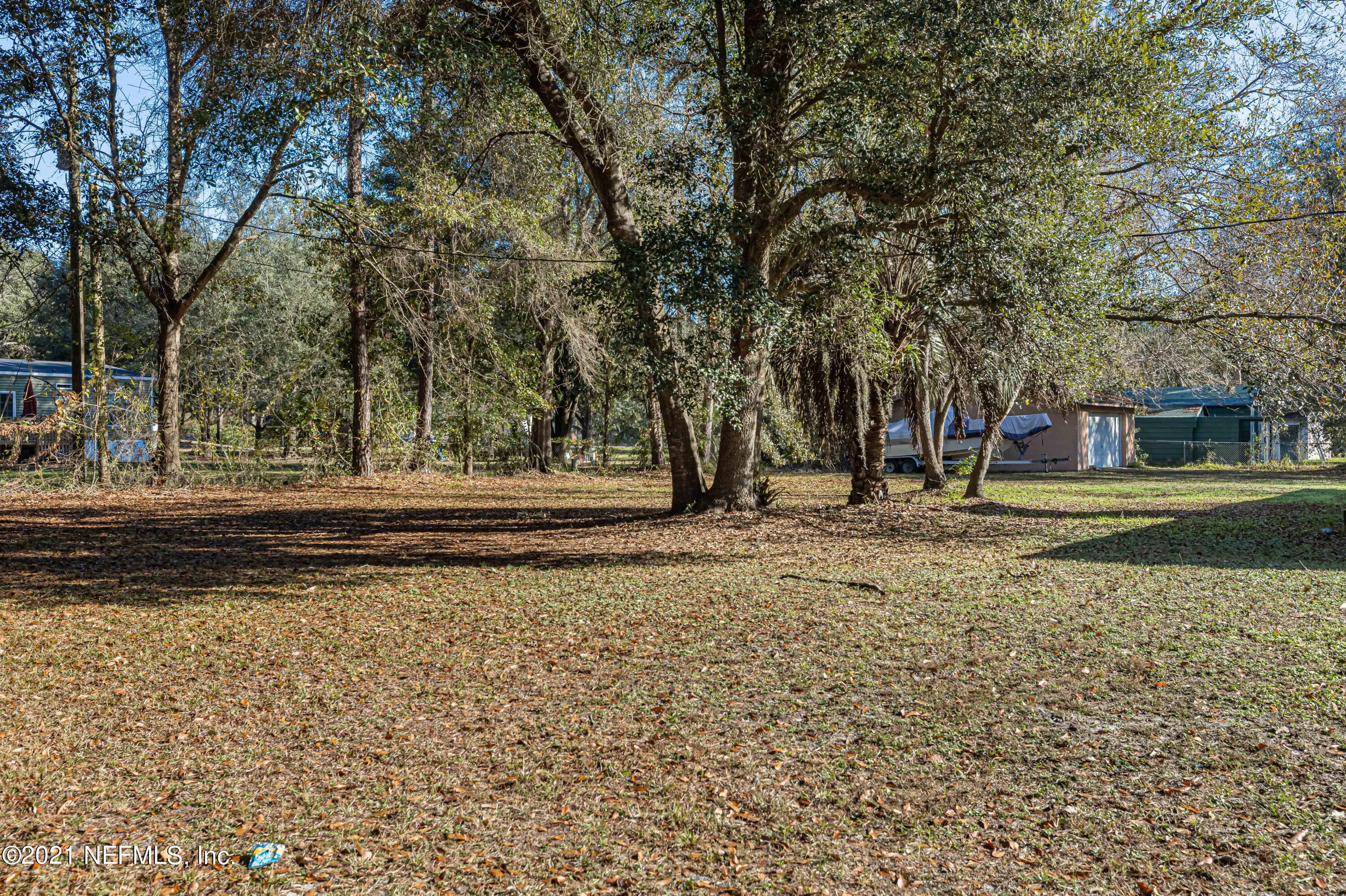 3970 Pinto Road Middleburg, FL 32068 - Photo 3 of 53 a view of a yard with large trees