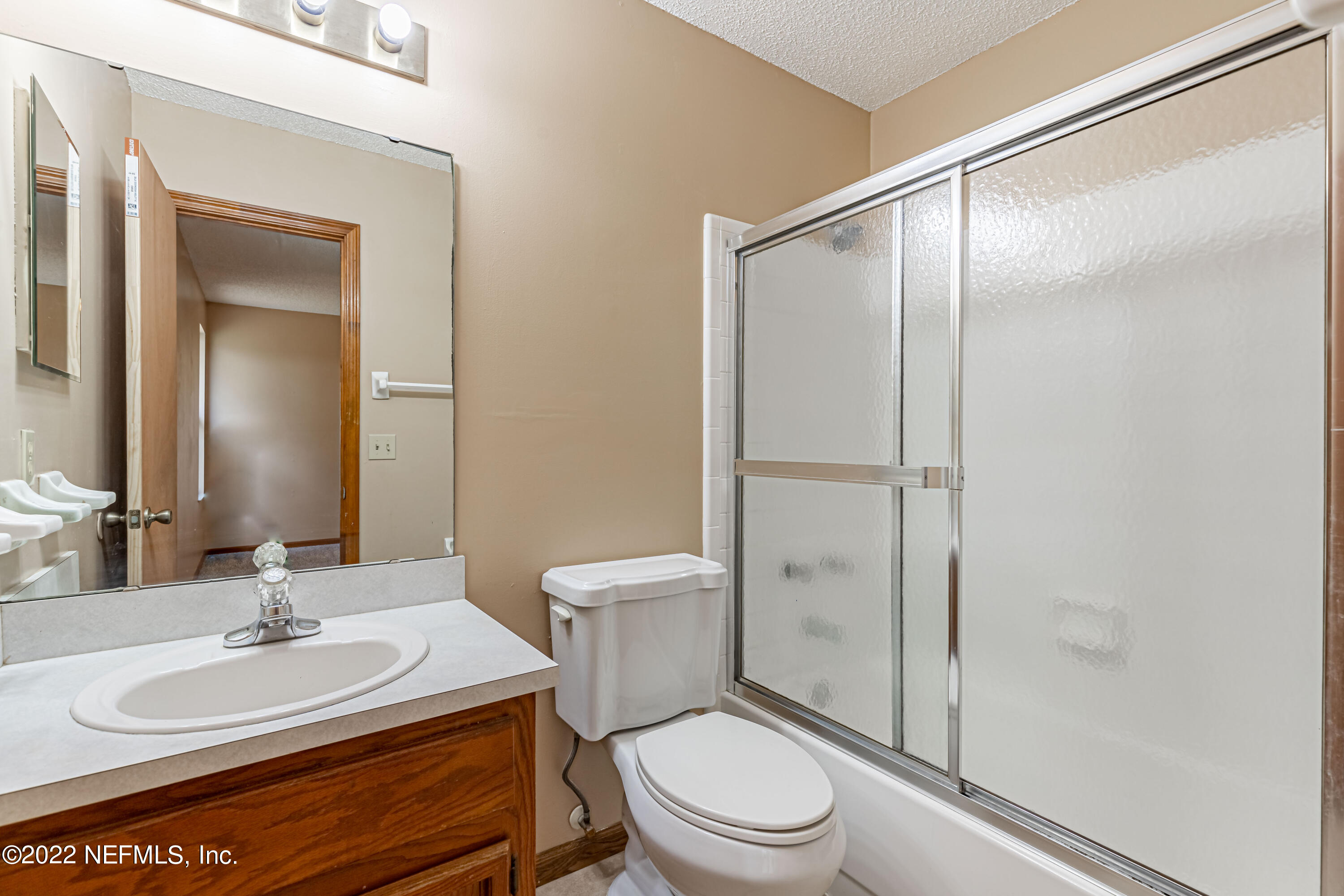 3970 Pinto Road Middleburg, FL 32068 - Photo 37 of 53 a bathroom with a sink a toilet and shower