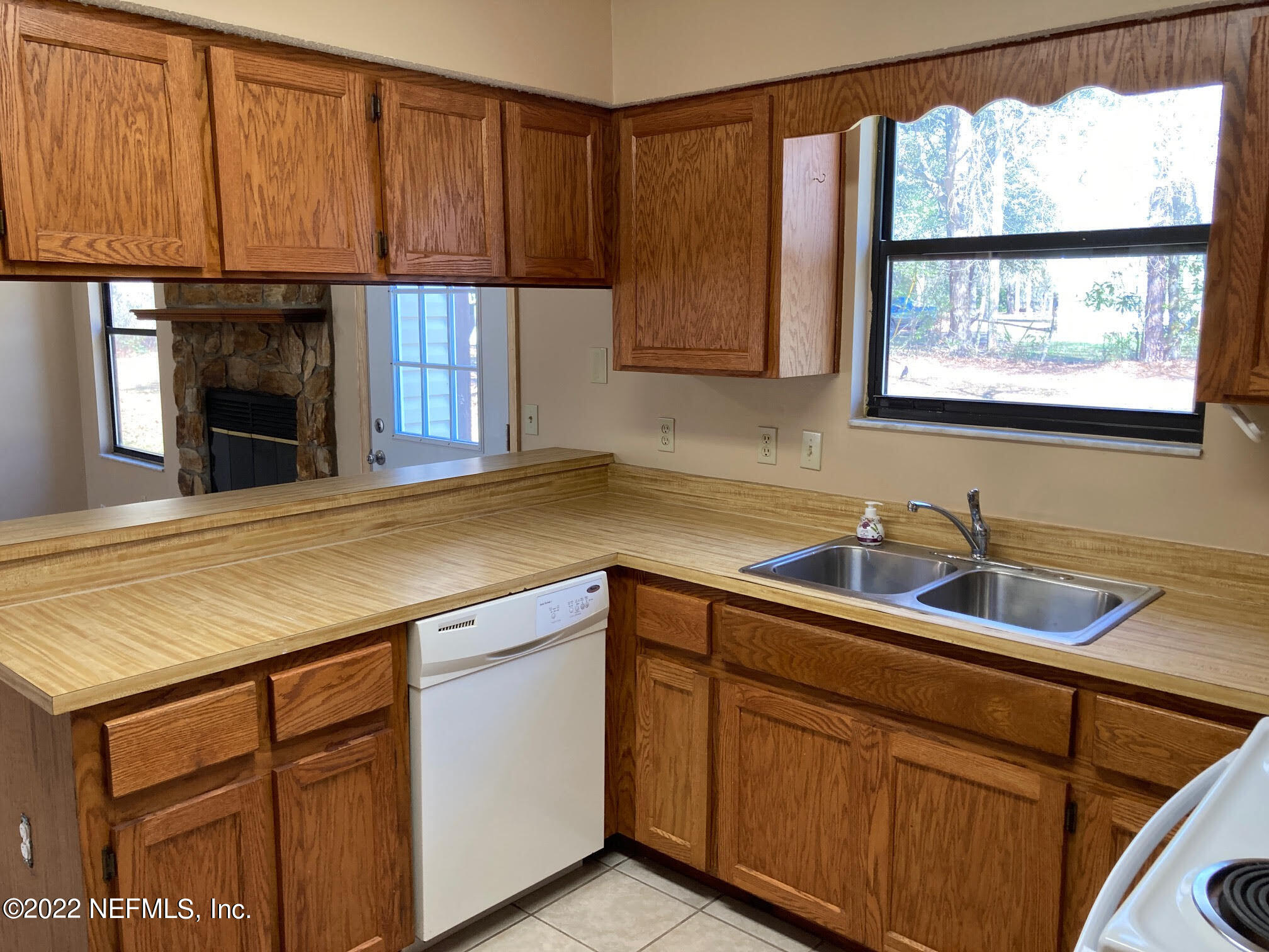 3970 Pinto Road Middleburg, FL 32068 - Photo 9 of 53 a kitchen with stainless steel appliances granite countertop a sink and a cabinets