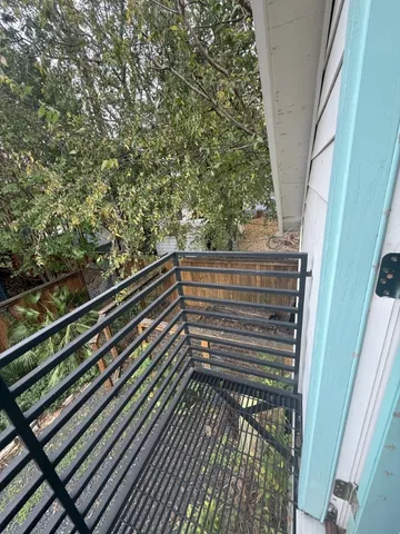 a view of a balcony with a street