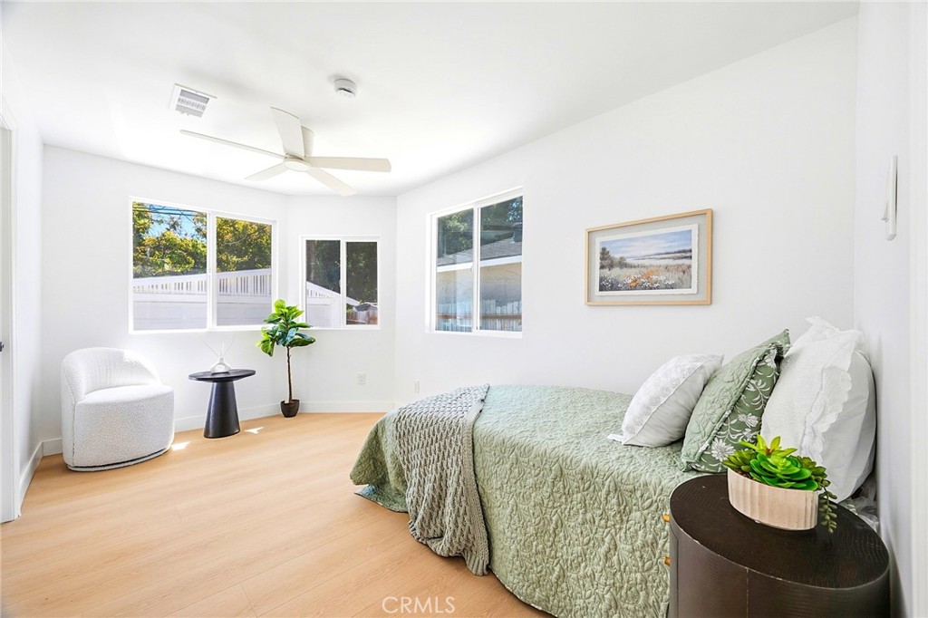 1280 East Woodbury Road Pasadena, CA 91104 - Photo 33 of 40 a spacious bedroom with a bed and a couch