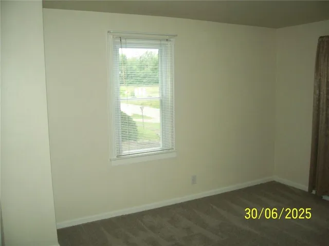 a view of an empty room and window