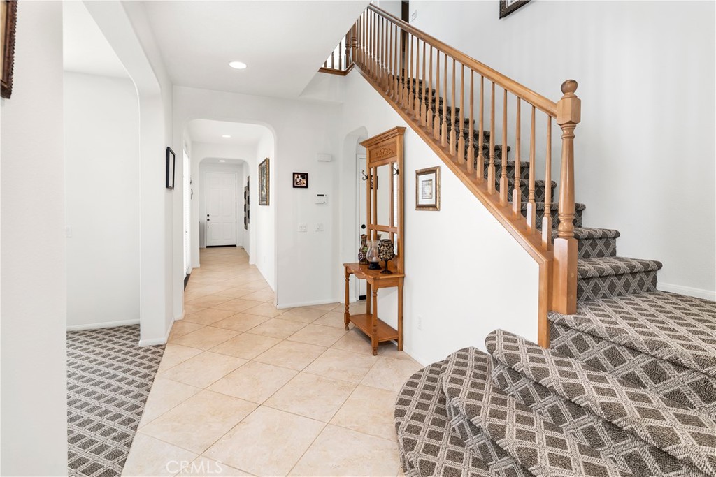 40494 Corrigan Place Temecula, CA 92591 - Photo 11 of 67 a view of a hallway with wooden floor and staircase