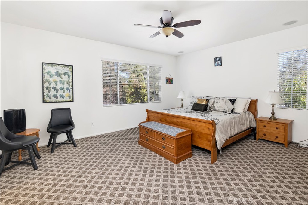 40494 Corrigan Place Temecula, CA 92591 - Photo 35 of 67 a bedroom with a bed and wooden floor