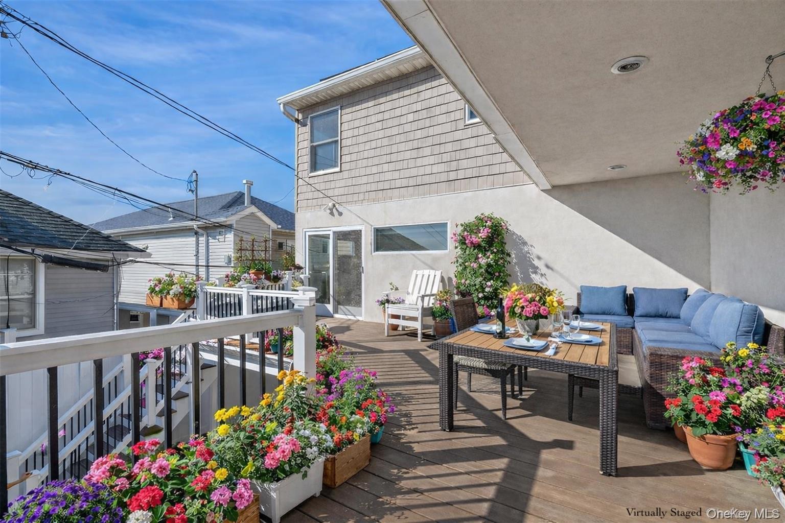 71 Michigan Street Long Beach, NY 11561 - Photo 15 of 48 a outdoor dining space with lots of furniture and plants