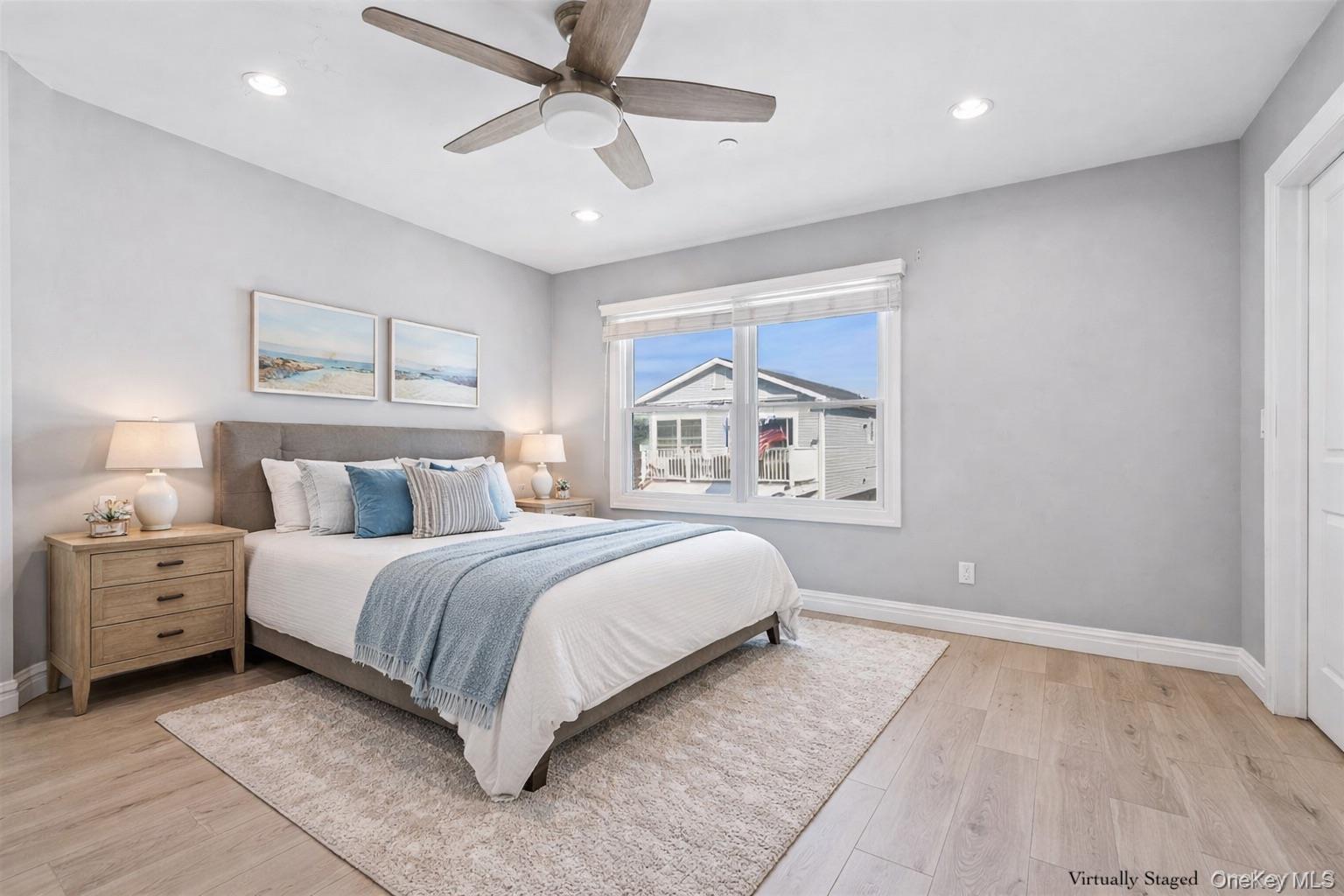 71 Michigan Street Long Beach, NY 11561 - Photo 23 of 48 a bedroom with a large bed and a window