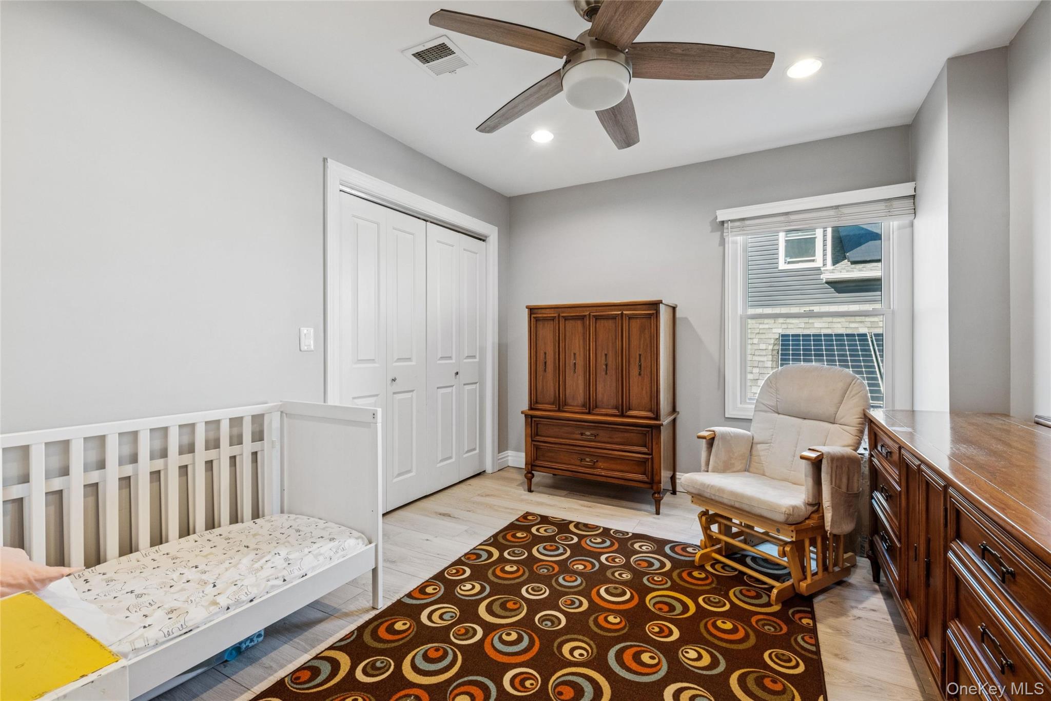 71 Michigan Street Long Beach, NY 11561 - Photo 29 of 48 a bedroom with furniture and wooden floor