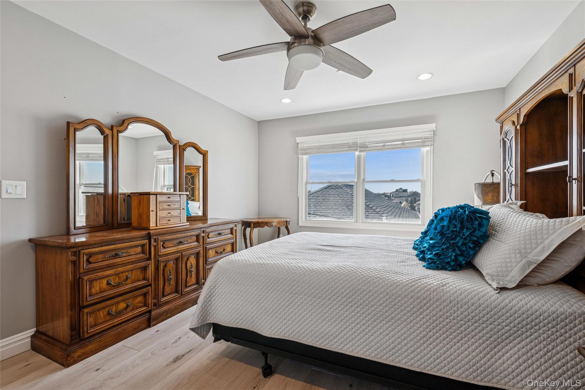 71 Michigan Street Long Beach, NY 11561 - Photo 32 of 48 a bedroom with a bed and a dresser