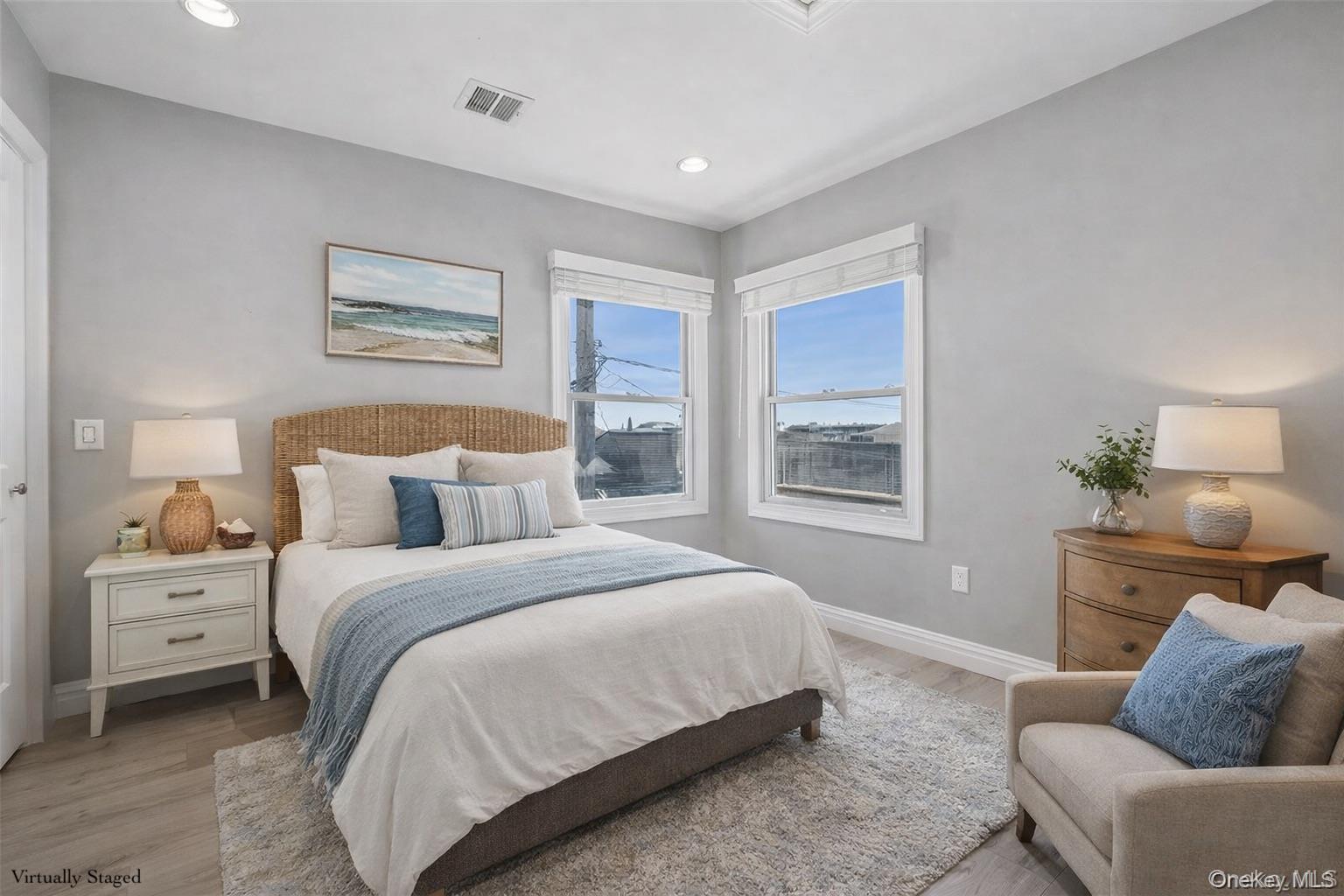 71 Michigan Street Long Beach, NY 11561 - Photo 33 of 48 a bedroom with a bed and a couch