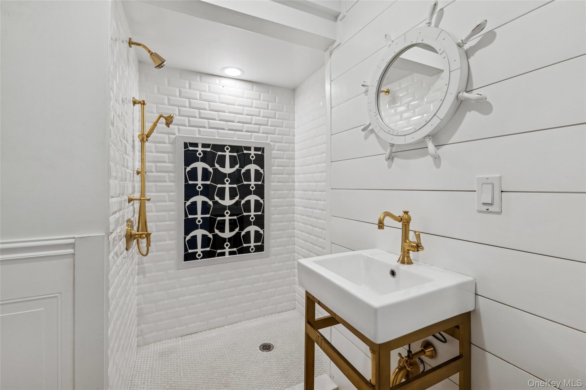 71 Michigan Street Long Beach, NY 11561 - Photo 38 of 48 a bathroom with a sink a mirror and vanity