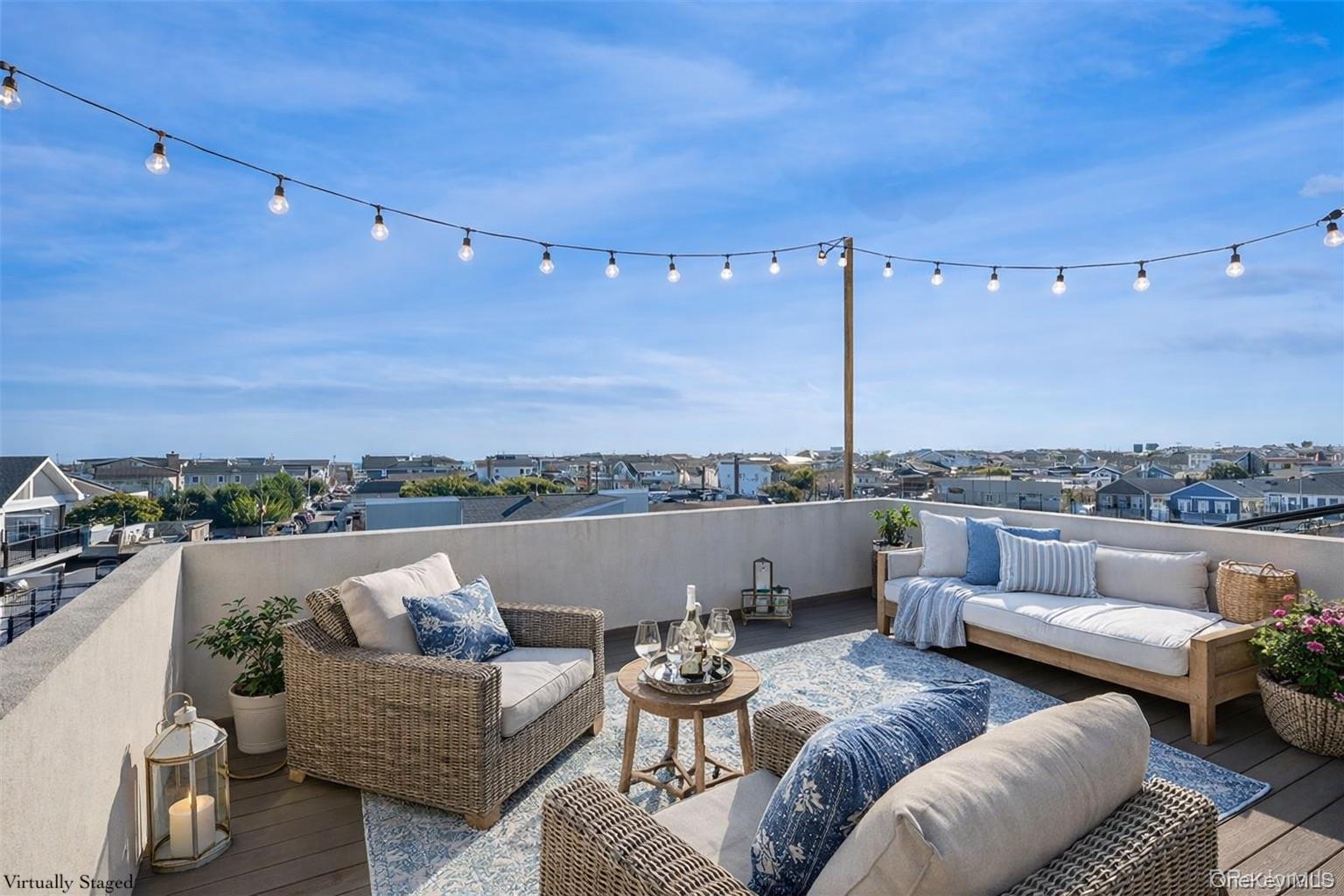 71 Michigan Street Long Beach, NY 11561 - Photo 43 of 48 a terrace view with seating space and a projector