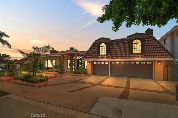 a front view of residential houses with yard