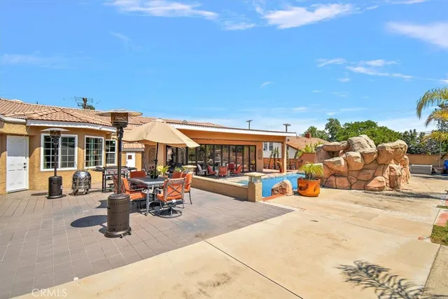 a living room with furniture a rug and a large window