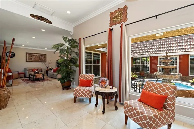 a living room with furniture and a large window