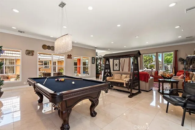 a kitchen with a refrigerator and white cabinets