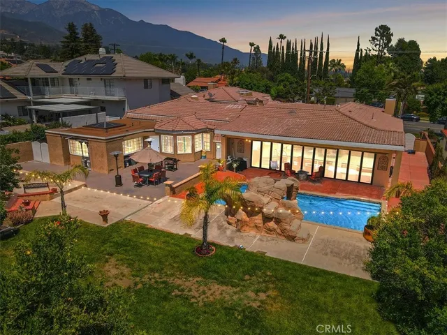 a kitchen with stainless steel appliances kitchen island granite countertop a stove and white cabinets