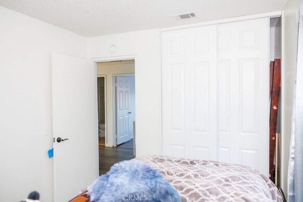 575 Prairie Way Perris, CA 92571 - Photo 6 of 9 a bedroom with a bed and a mirror