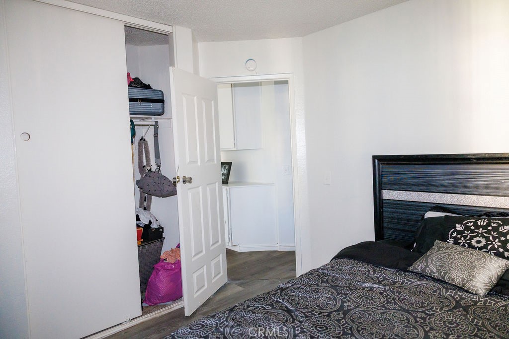 575 Prairie Way Perris, CA 92571 - Photo 7 of 9 a bedroom with a bed and a couch