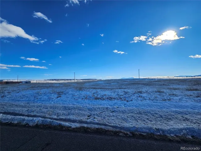 a view of a room with lots of space and wooden floor