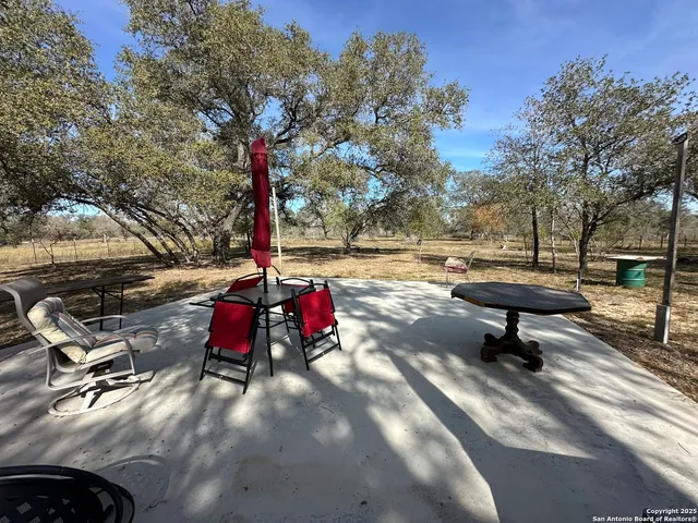 a blue house with trees in front of it