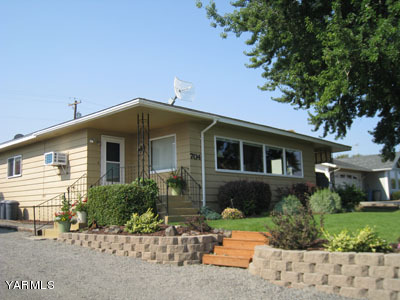704 Meadowbrook Road Yakima, WA 98903 - Photo 1 of 33 a front view of a house with a yard