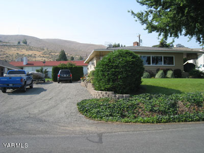 704 Meadowbrook Road Yakima, WA 98903 - Photo 4 of 33 a view of a car parked in front of a house