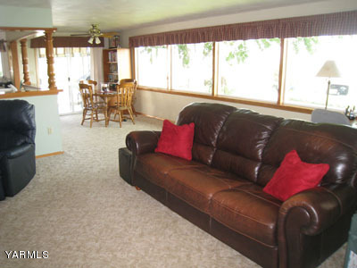 704 Meadowbrook Road Yakima, WA 98903 - Photo 9 of 33 a living room with furniture and a large window
