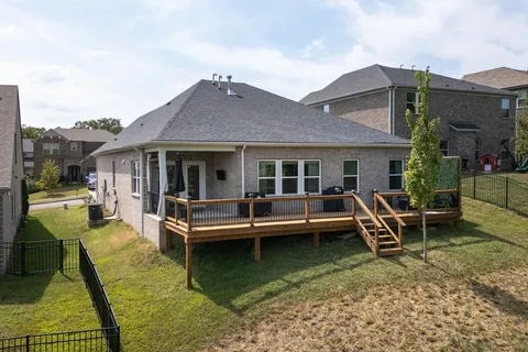 a view of a house with a yard porch and sitting area