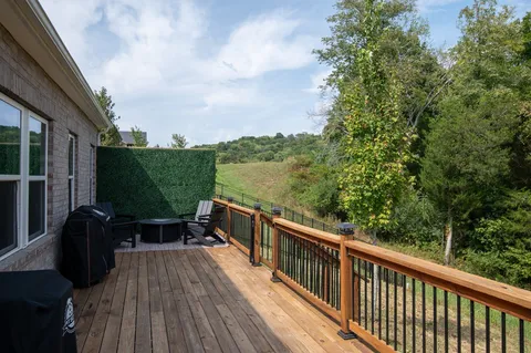 a view of balcony with furniture