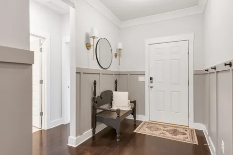 a room that has a bed and a chair in it