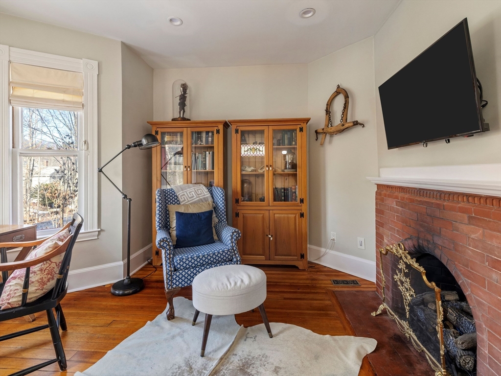 4 Latisquama Road Southborough, MA 01772 - Photo 13 of 42 a living room with furniture and a fireplace