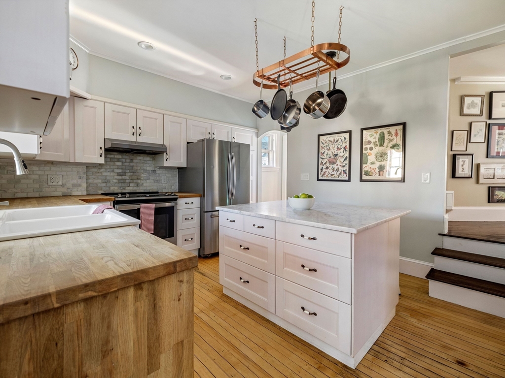 4 Latisquama Road Southborough, MA 01772 - Photo 19 of 42 a kitchen with a cabinets and chandelier