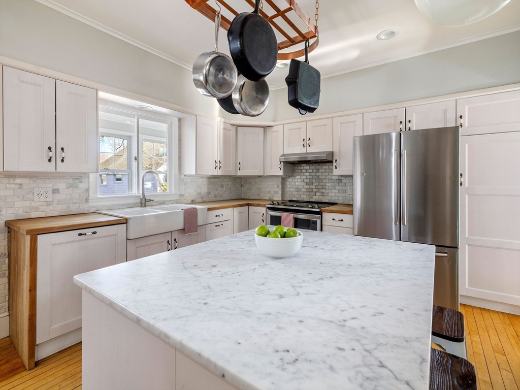4 Latisquama Road Southborough, MA 01772 - Photo 23 of 42 a kitchen with stainless steel appliances granite countertop a sink a stove and a refrigerator