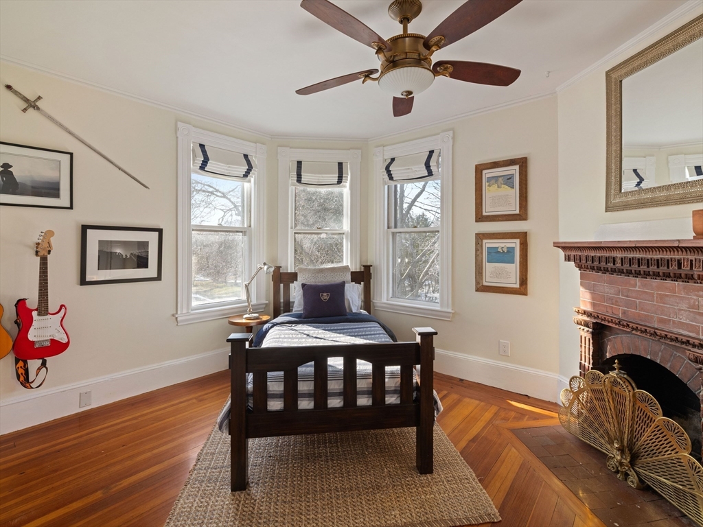 4 Latisquama Road Southborough, MA 01772 - Photo 30 of 42 a livingroom with furniture a fireplace and wooden floor