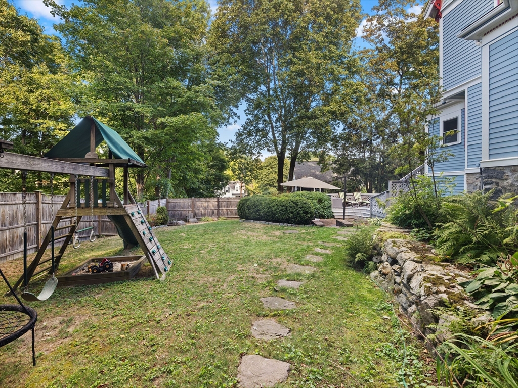 4 Latisquama Road Southborough, MA 01772 - Photo 7 of 42 a view of a wooden deck and a backyard