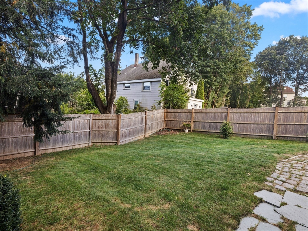 4 Latisquama Road Southborough, MA 01772 - Photo 9 of 42 a view of a yard with wooden fence