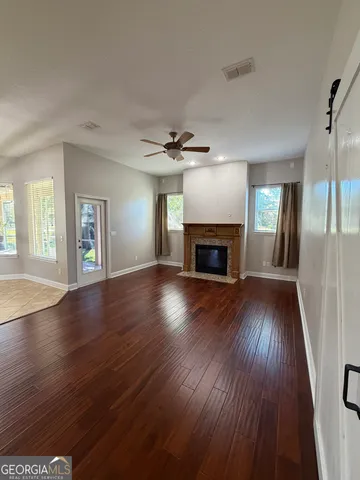 a large kitchen with stainless steel appliances granite countertop a refrigerator and a sink