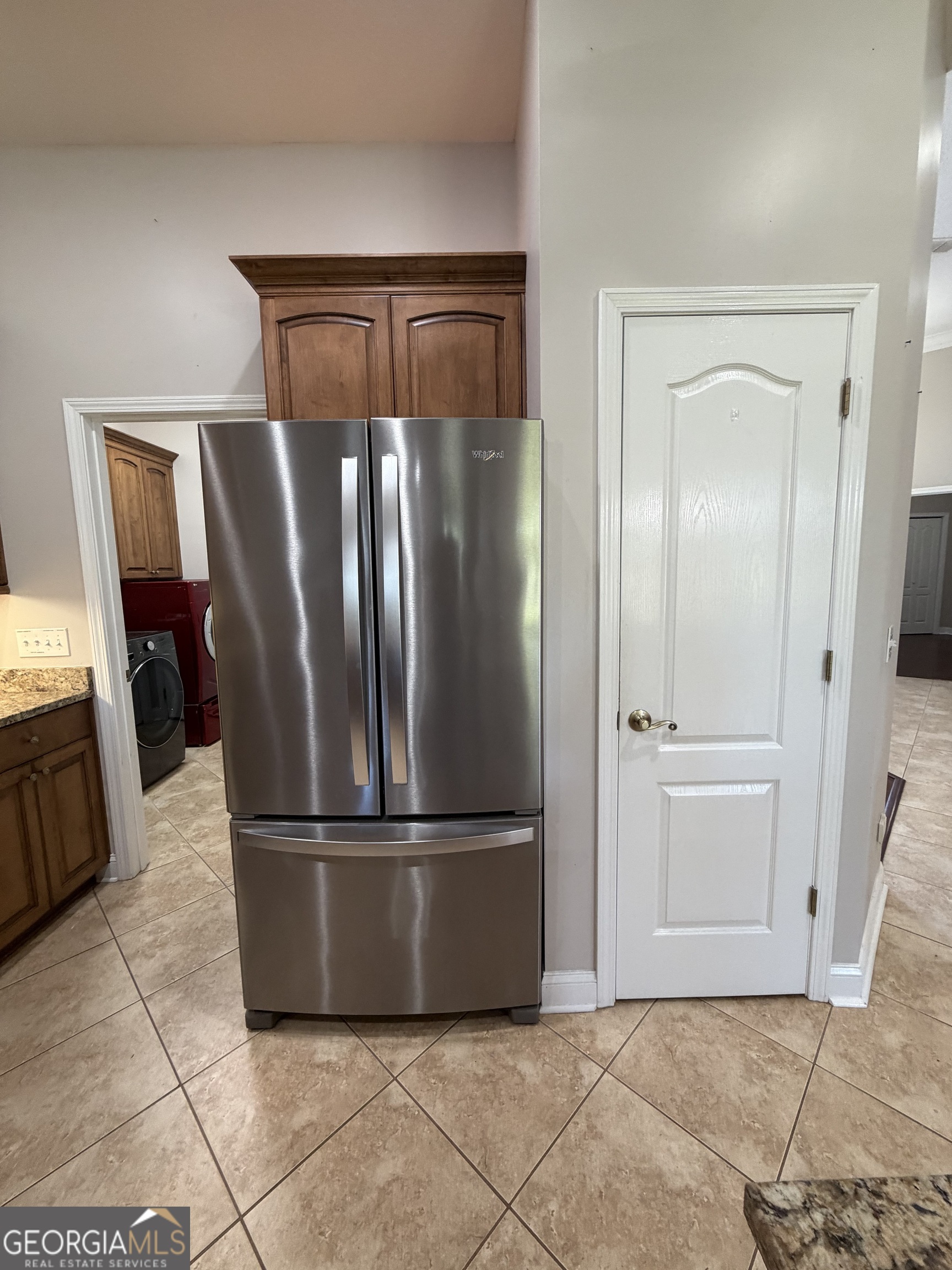 108 Heron's Nest Circle Kingsland, GA 31548 - Photo 20 of 62 a metallic refrigerator freezer sitting in a kitchen