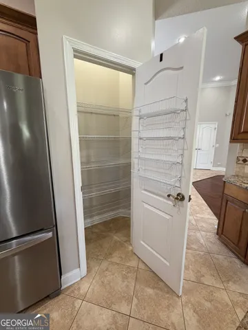 a view of a livingroom with a ceiling fan and window