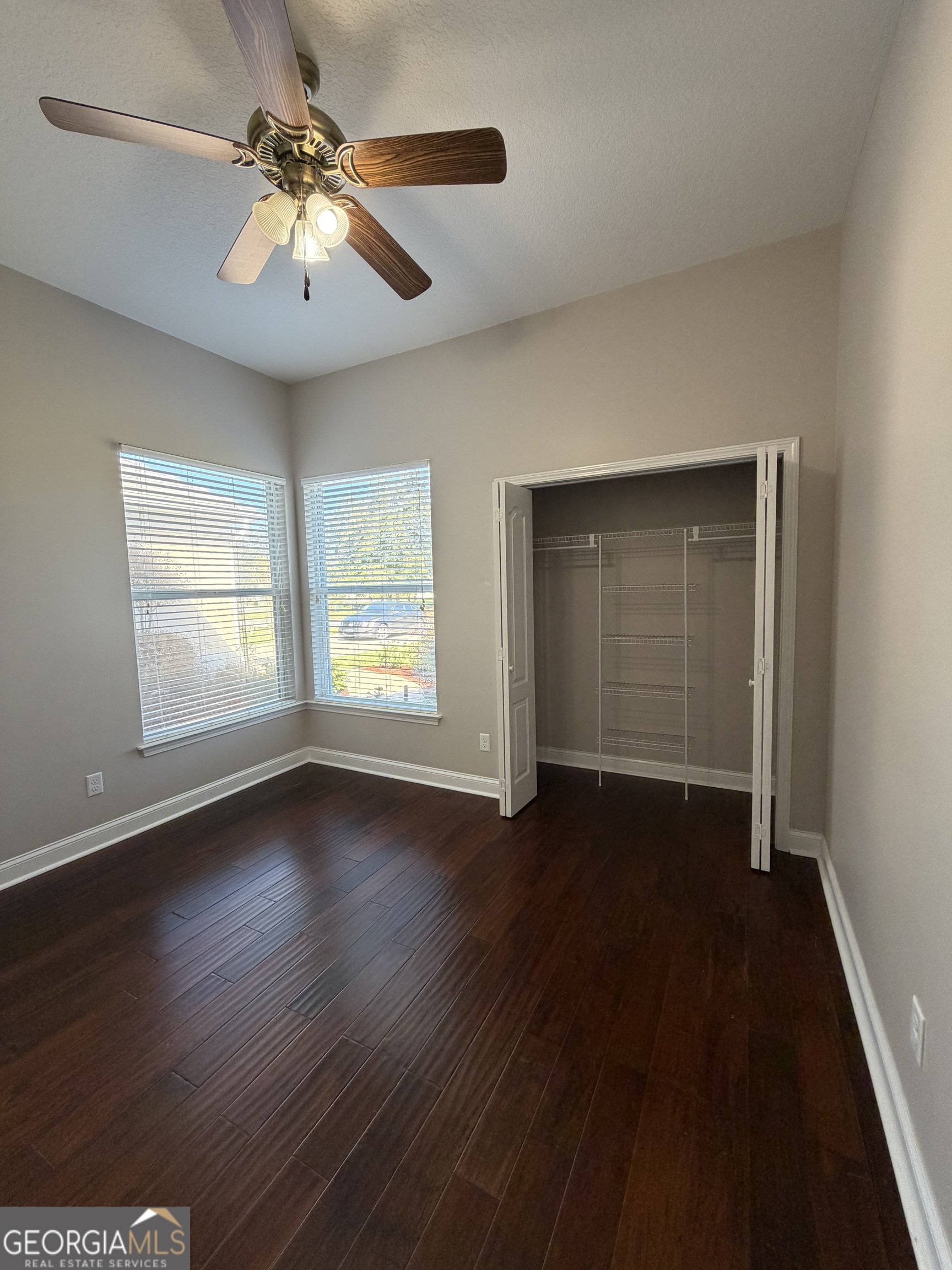 108 Heron's Nest Circle Kingsland, GA 31548 - Photo 24 of 62 a view of an empty room with wooden floor and a window