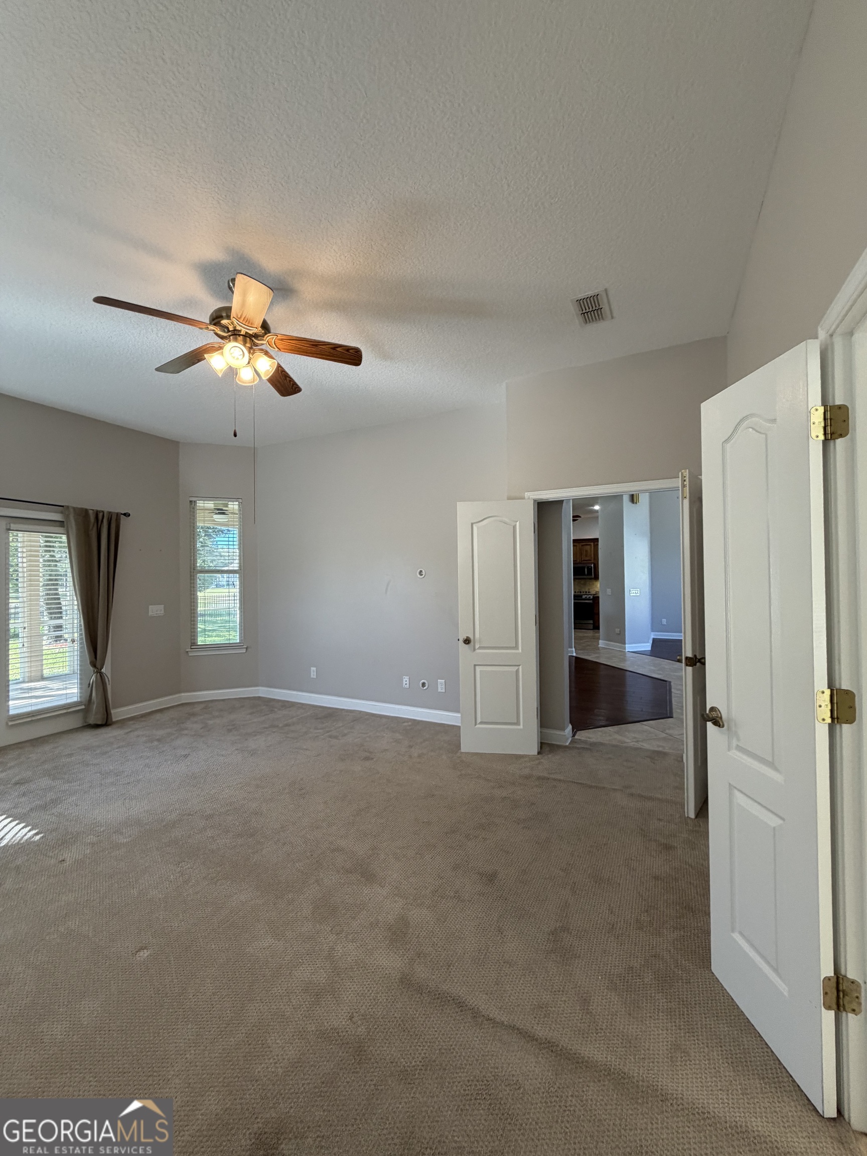 108 Heron's Nest Circle Kingsland, GA 31548 - Photo 26 of 62 a view of a livingroom with a ceiling fan and window