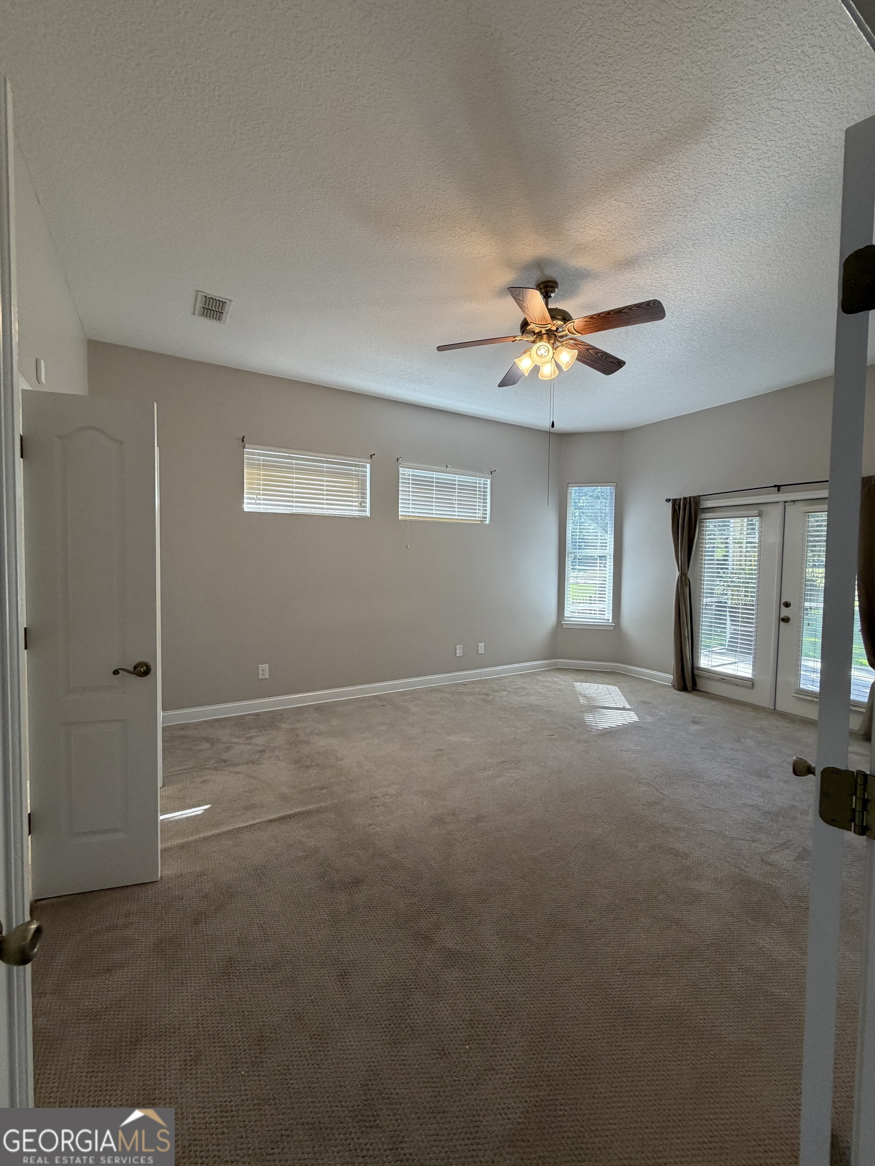 108 Heron's Nest Circle Kingsland, GA 31548 - Photo 28 of 62 a view of a livingroom with a ceiling fan and window
