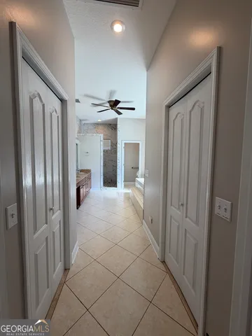 a large bathroom with a large tub and sink
