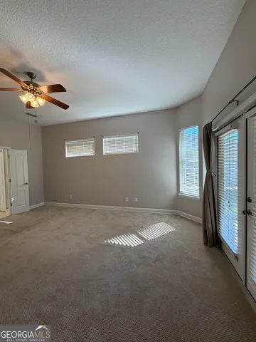 a bathroom with a shower and a sink