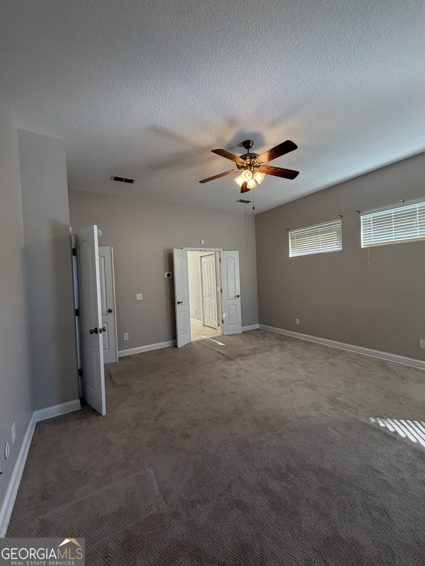 108 Heron's Nest Circle Kingsland, GA 31548 - Photo 31 of 62 a view of a livingroom with a ceiling fan