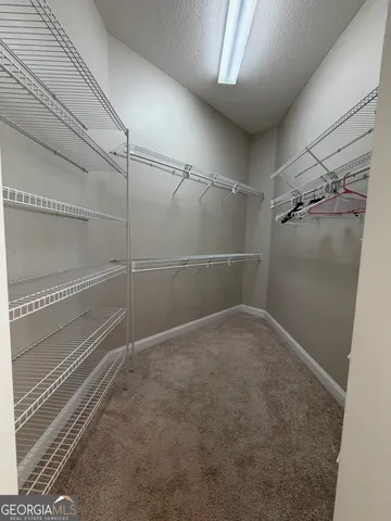 a white toilet sitting next to a window