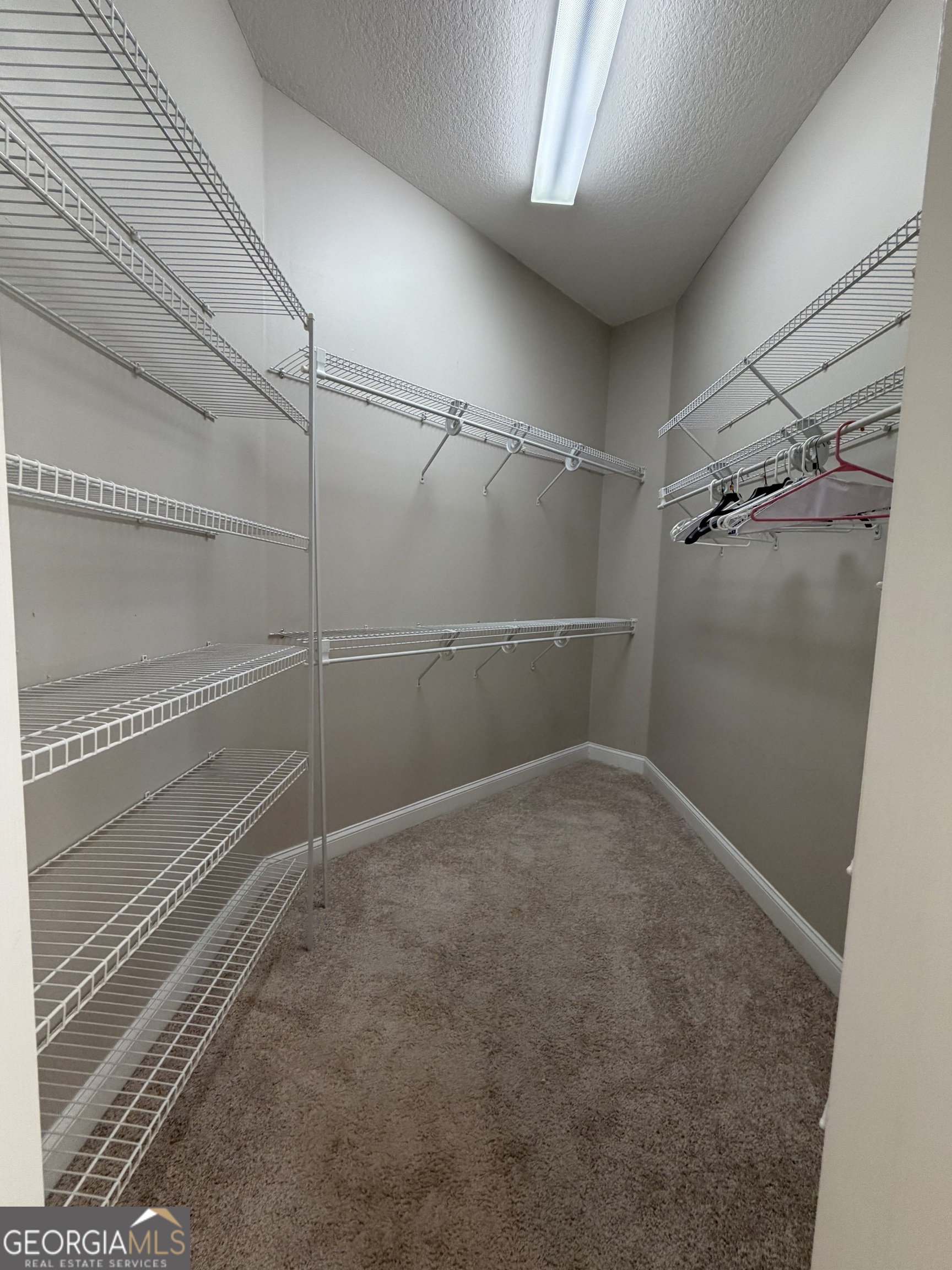 108 Heron's Nest Circle Kingsland, GA 31548 - Photo 32 of 62 a view of a room with racks on the wall