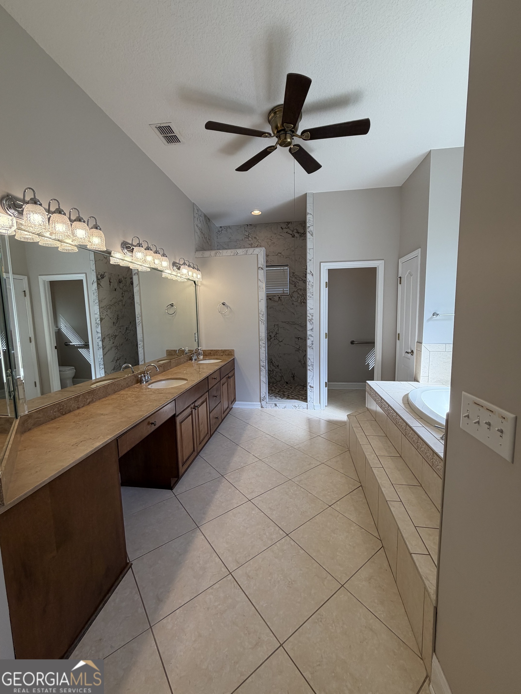108 Heron's Nest Circle Kingsland, GA 31548 - Photo 34 of 62 a large bathroom with a large tub and sink