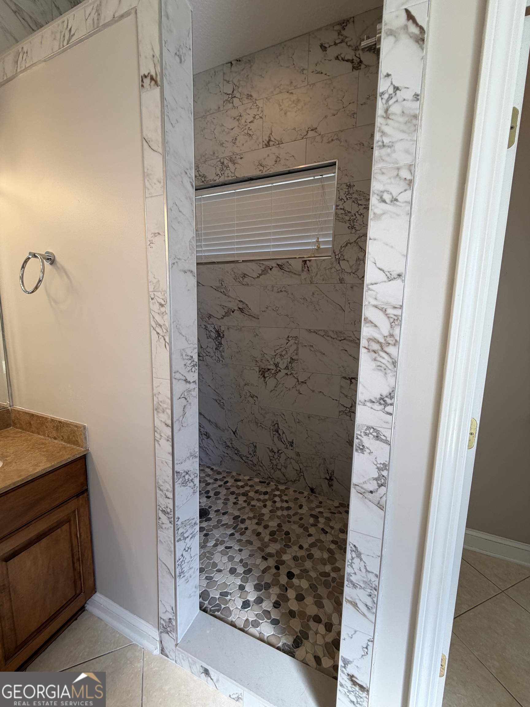 108 Heron's Nest Circle Kingsland, GA 31548 - Photo 35 of 62 a bathroom with a shower and a sink